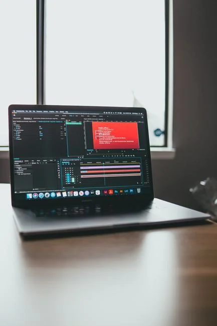 A contemporary workspace with two computer monitors showing web design projects, highlighting technology and productivity.
